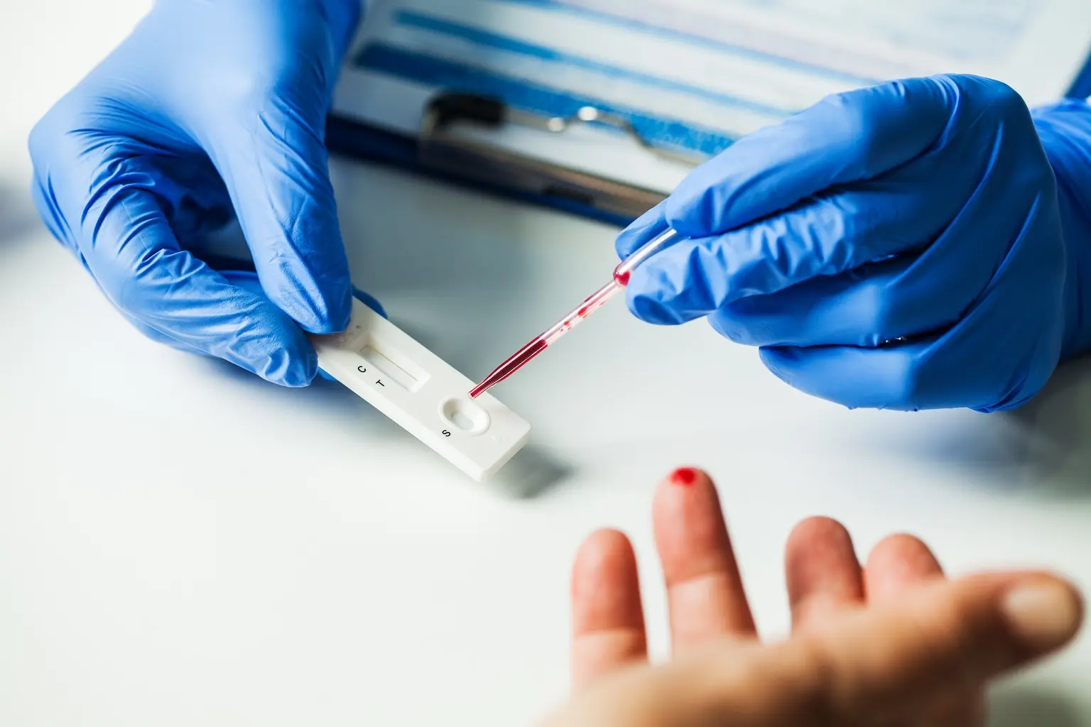 Doctor performing a blood test