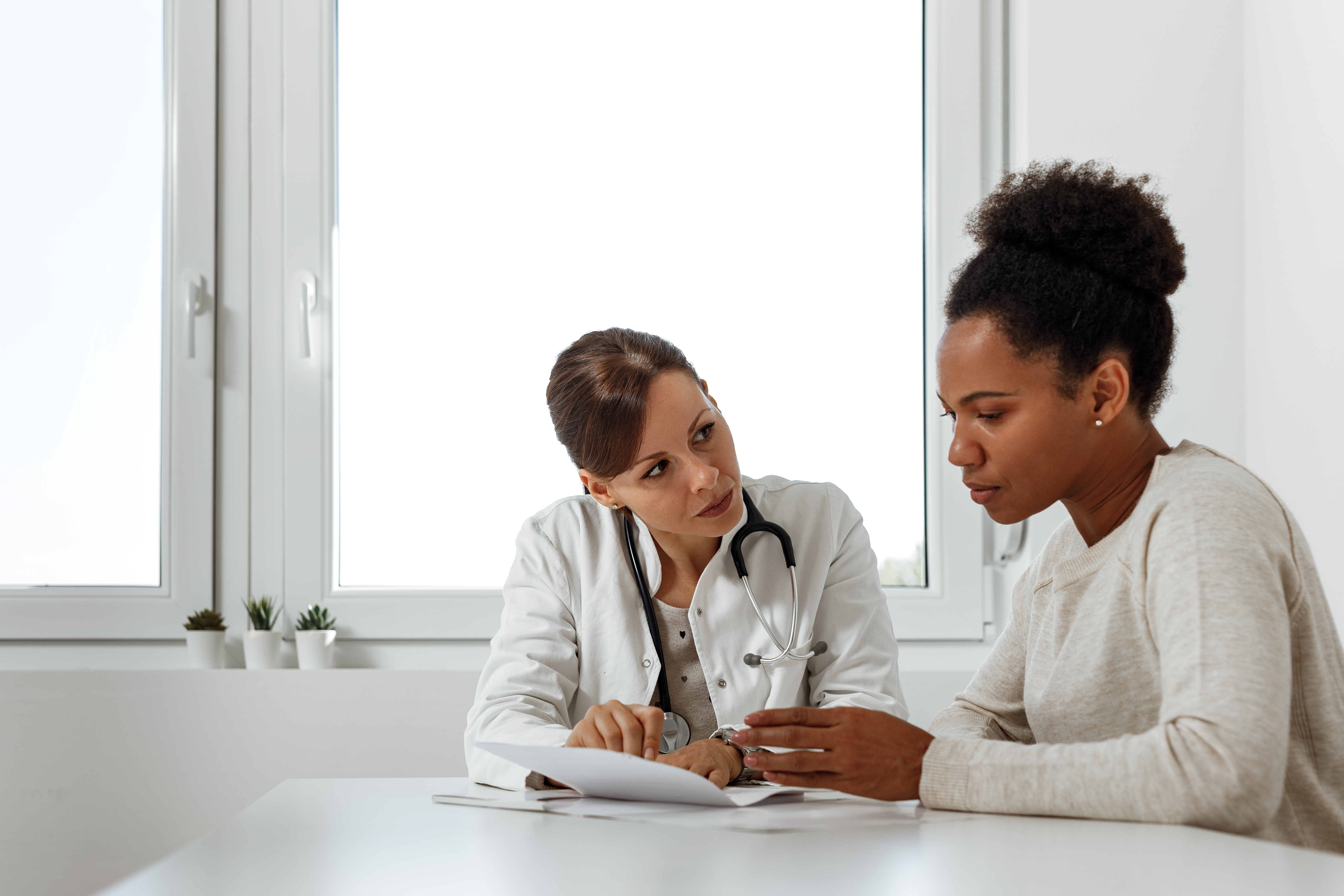 Doctor showing female patient results