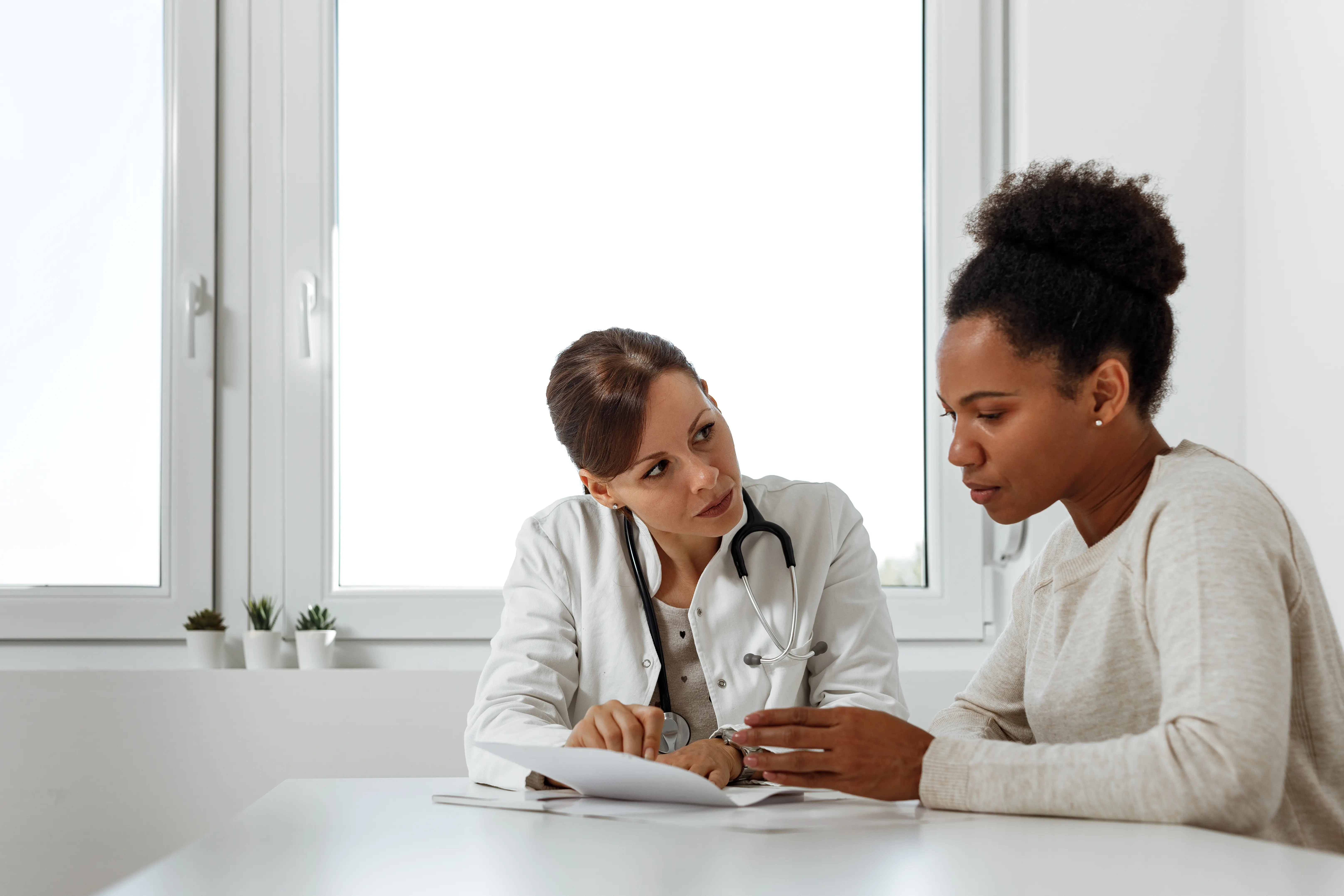 Female doctor showing patient results