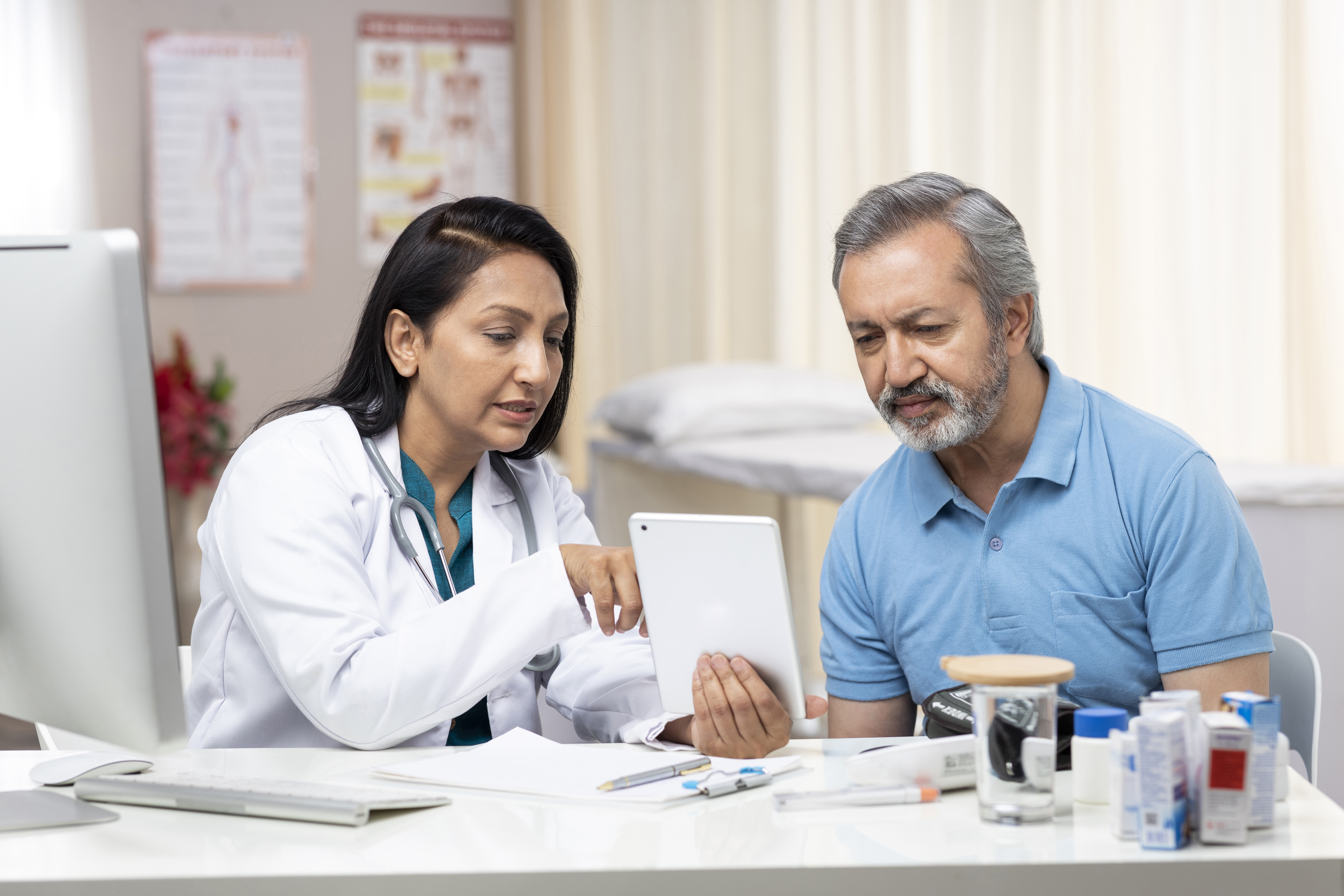 Female doctor and patient looking at results