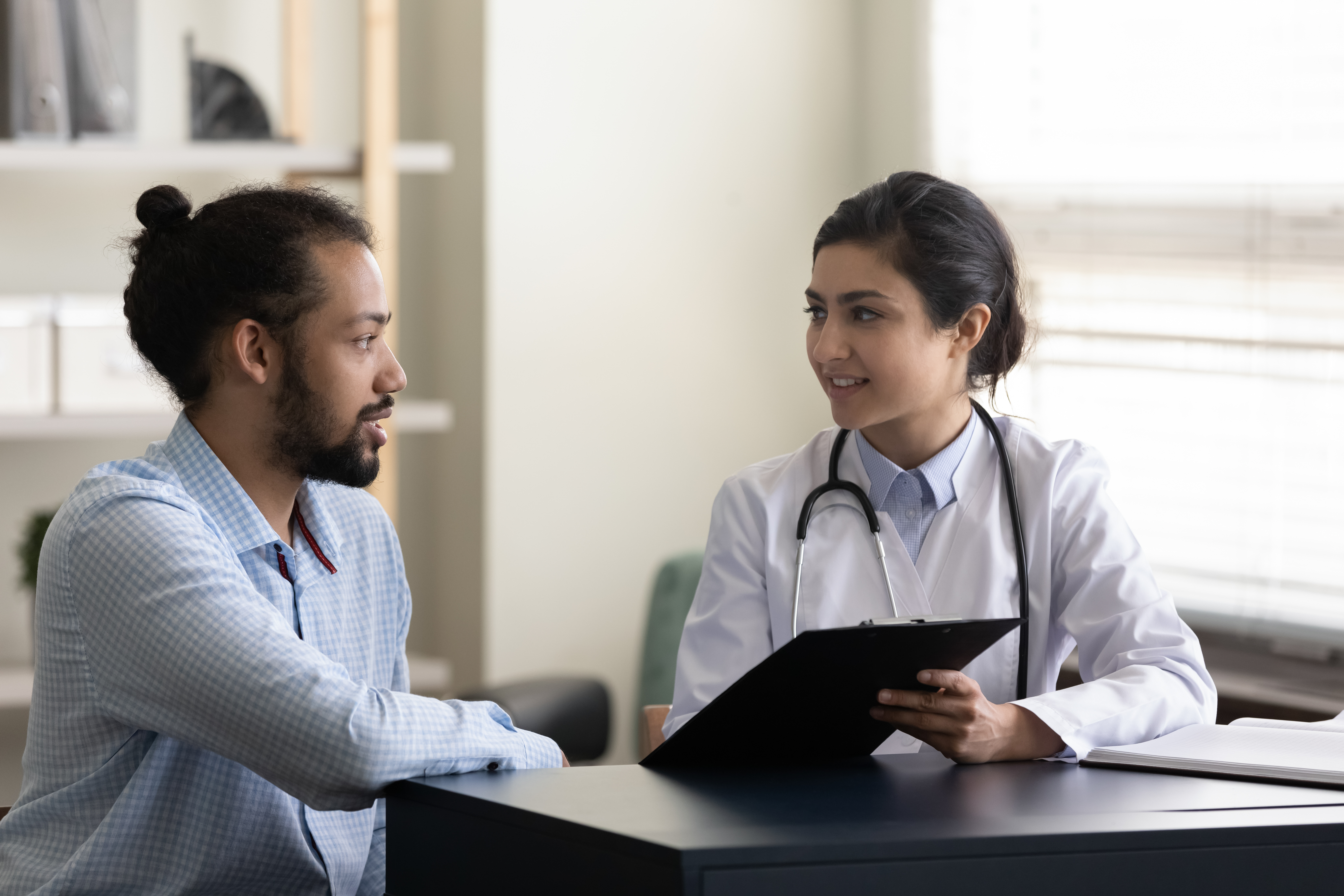 Doctor taking patient information