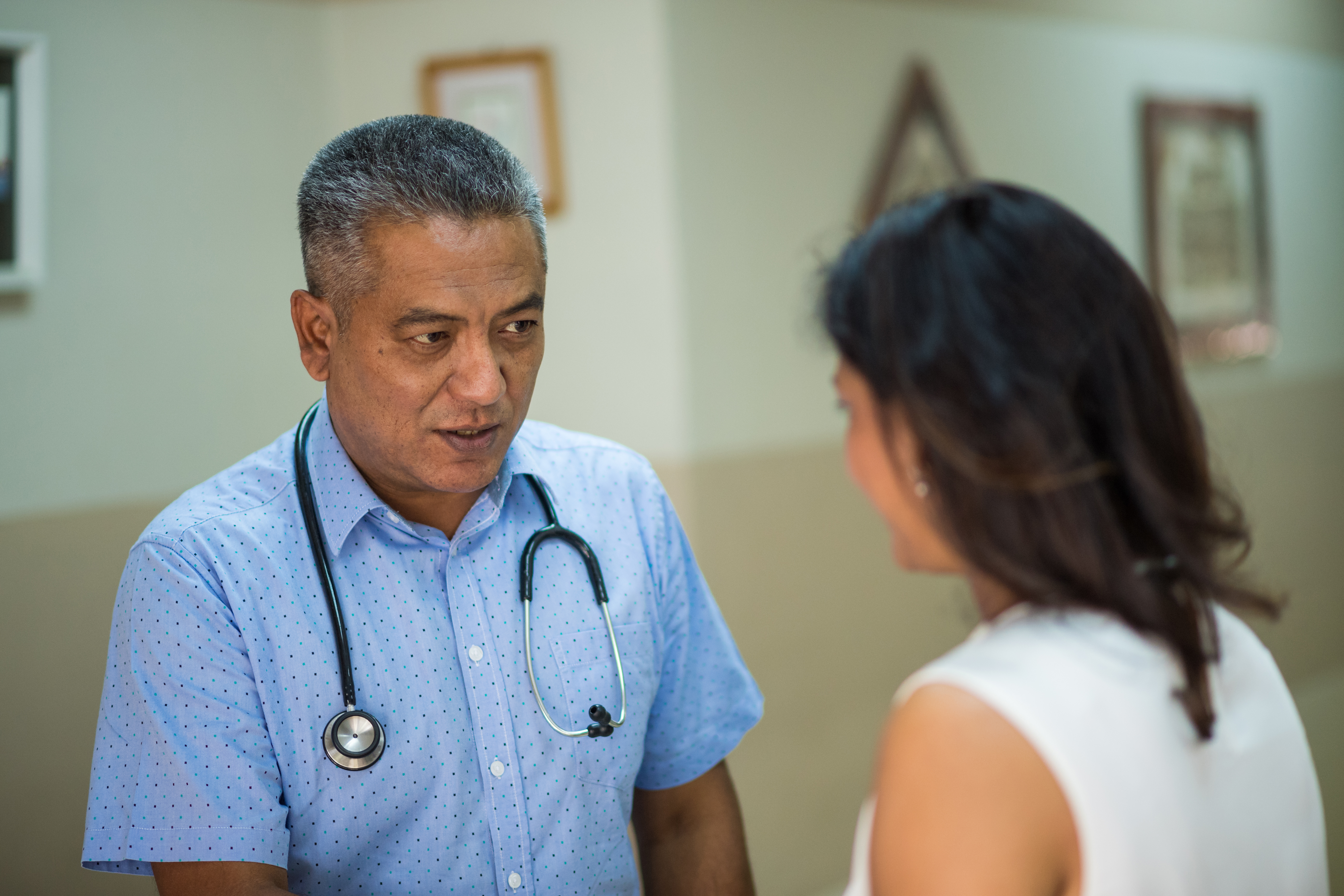 Doctor talking to a female patient