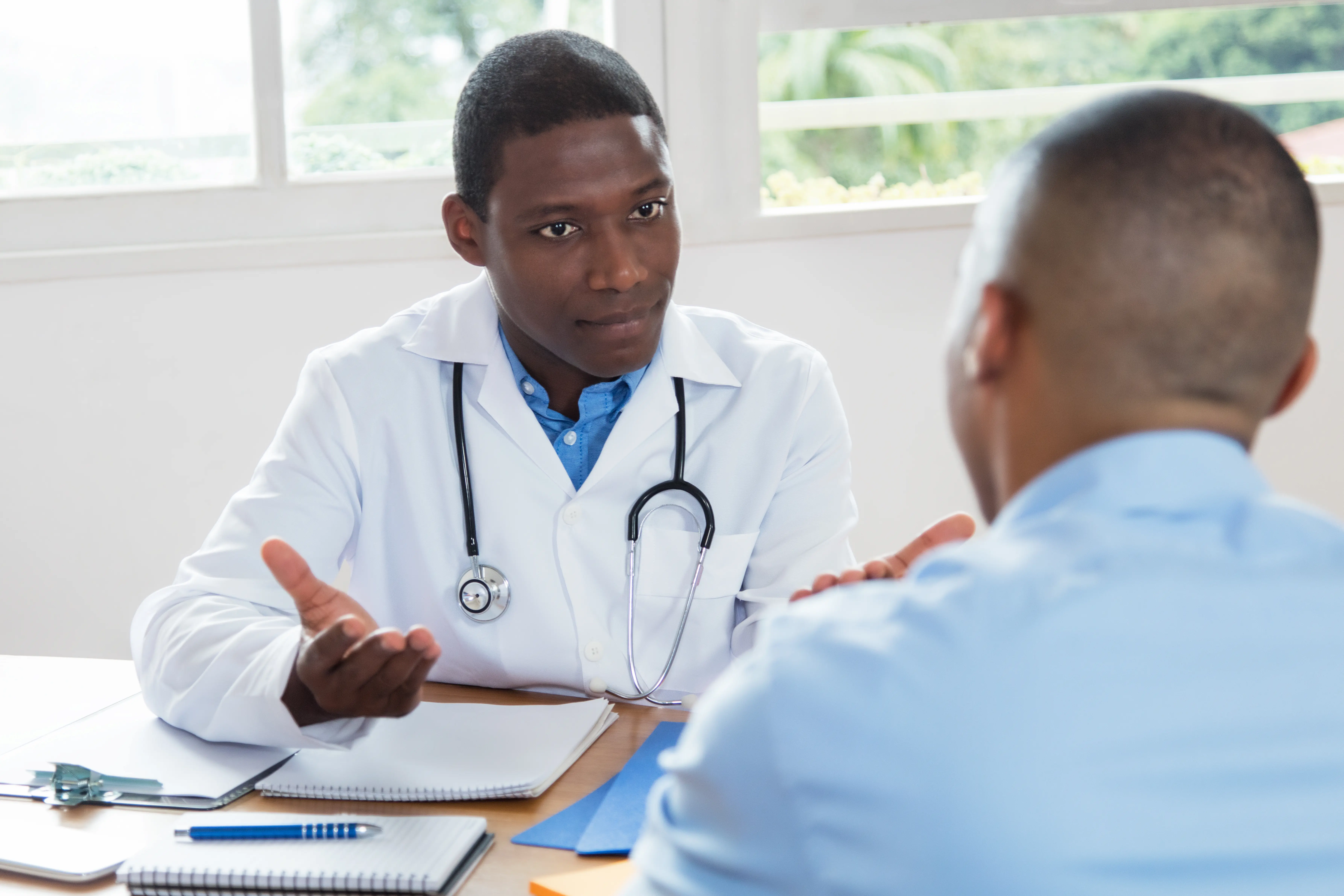 Doctor and patient talking at a desk